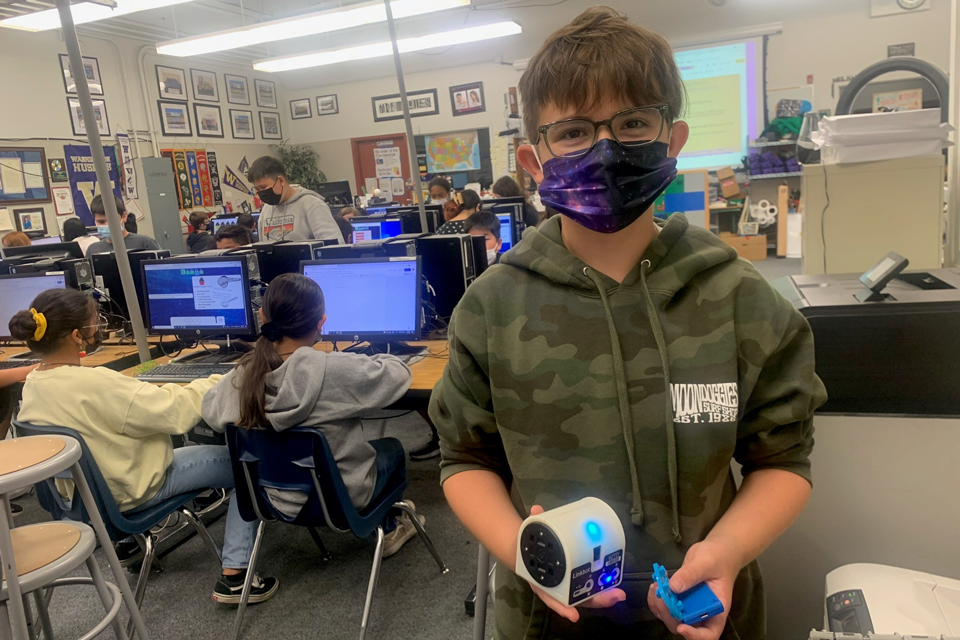 Mt. Diablo student holding a robot